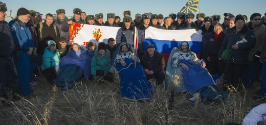 NASA Flight Engineer Karen Nyberg, left, Expedition 37 Commander Fyodor Yurchikhin of Roscosmos, center, and European Space Agency Flight Engineer Luca Parmitano sit in chairs outside the Soyuz capsule just minutes after they landed in Kazakhstan. Image Credit: NASA/Carla Cioffi
