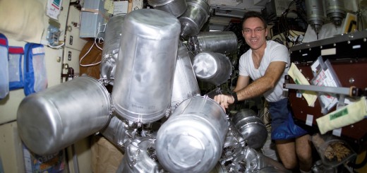 Astronaut Carl E. Walz, Expedition Four flight engineer, catalogs canisters of water in the Zvezda Service Module on the International Space Station (ISS). Credit: NASA