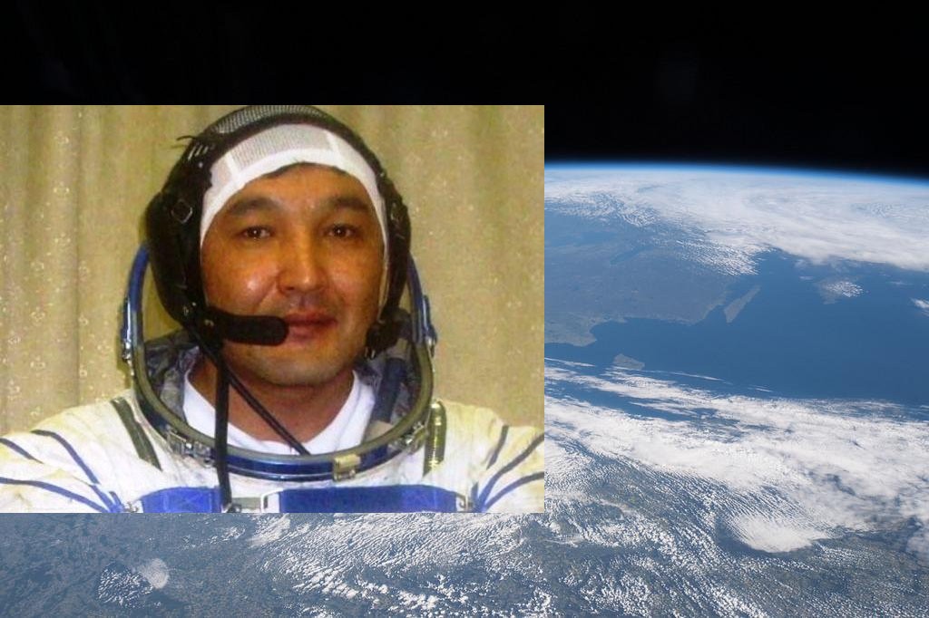 Il cosmonauta kazako Aidyn Aimbetov con la Terra vista dalla ISS sullo sfondo. Credits: NASA/Astana city website